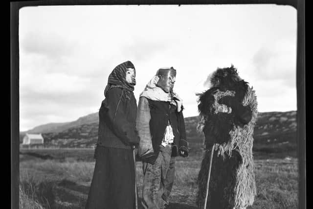 Young people on South Uist celebrate Samhain in 1932 with a scooped out sheep's head often used as a mask. PIC: South Uist Guisers, 1932, from Margaret Fay Shaw Photographic Archive, NTS Canna House.
