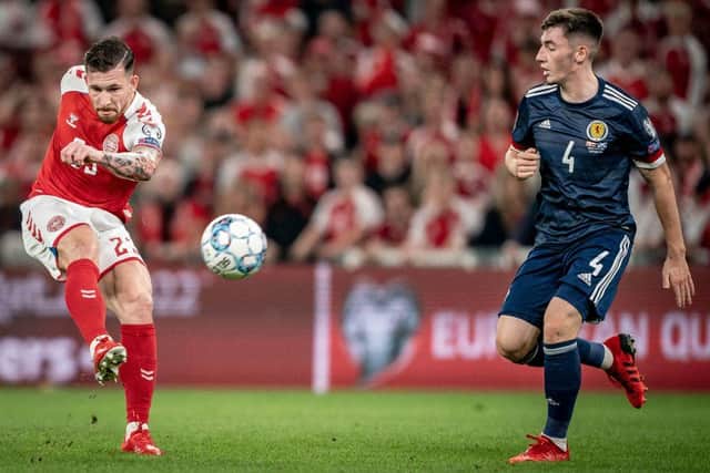 Denmark's midfielder Pierre-Emile Hoejbjerg (L) fights for the ball with Scotland's midfielderBilly Gilmour during the FIFA World Cup Qatar 2022 qualification football match between Denmark and Scotland in Copenhagen on September 1, 2021. (Photo by MADS CLAUS RASMUSSEN/Ritzau Scanpix/AFP via Getty Images)