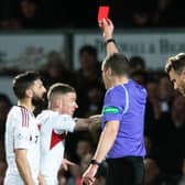 Aberdeen's Graeme Shinnie is shown a red card for his challenge on Ross County's Jack Baldwin following a VAR check. (Photo by Mark Scates / SNS Group)