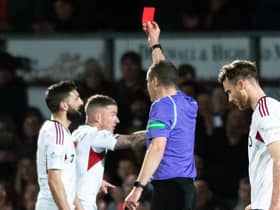 Aberdeen's Graeme Shinnie is shown a red card for his challenge on Ross County's Jack Baldwin following a VAR check. (Photo by Mark Scates / SNS Group)