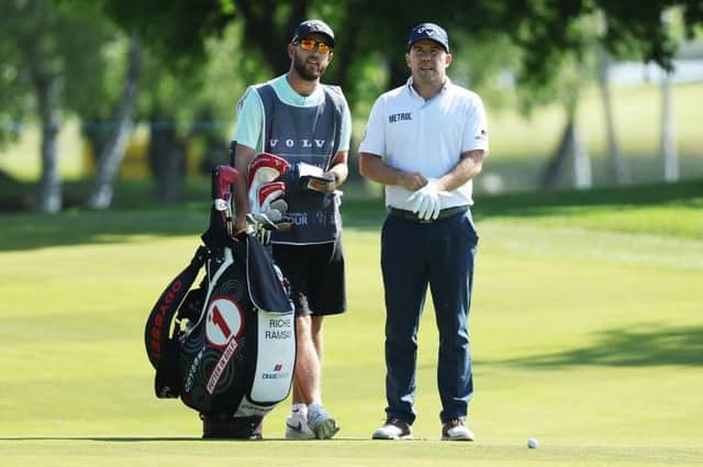 Richie Ramsay mulls over a shot with caddie Scott Carmichael during the Volvo Car Scandinavian Mixed at Ullna Golf & Country Club in Sweden. Picture: Matthew Lewis/Getty Images.