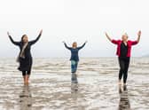 Nerea Bello, Julia Taudevin and Mairi Morrison are ill involved in the Fringe show Move, which is being staged on Silverknowes Beach this week. Picture: Lisa Ferguson