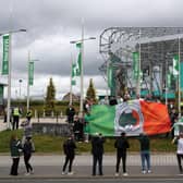 Celtic fans celebrate outside Celtic Park today.