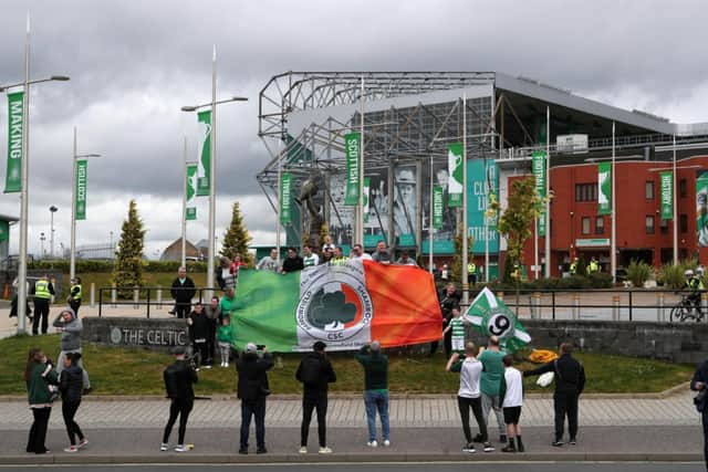 Celtic fans celebrate outside Celtic Park today.