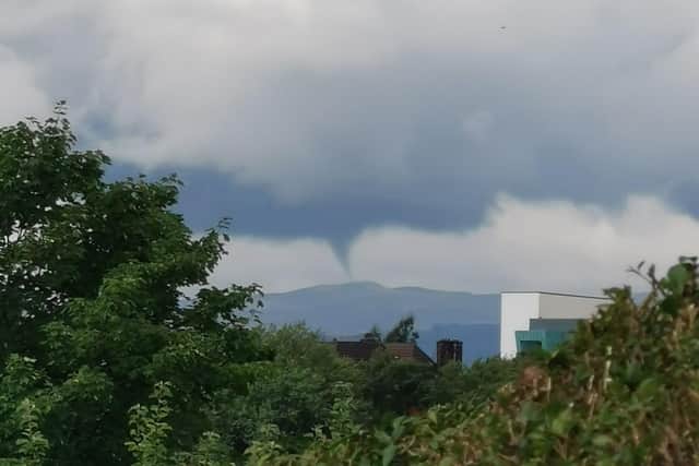 The photo shows a spout of cloud reaching towards the ground - thankfully it did not connect on this occasion.