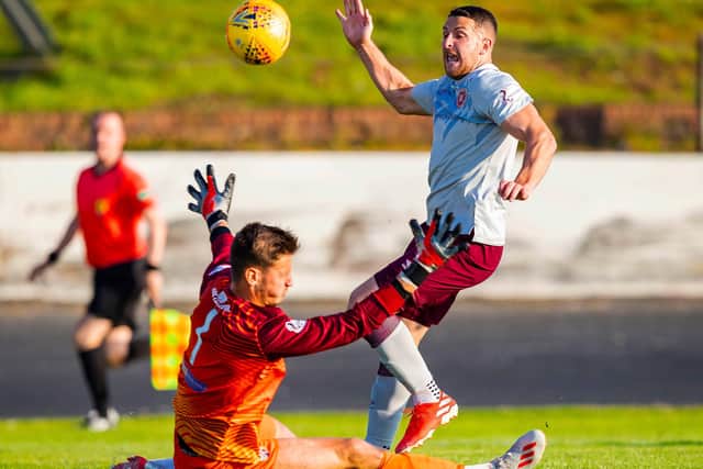 Kevin Dabrowski, on loan at Cowdenbeath, denies Hearts striker Conor Washington in a Betfred Cup match in July, 2019.