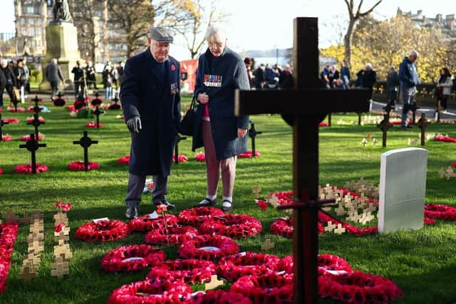 Members of the public attend the service of Remembrance to commemorate Armistice Day at the Scott Monument in Edinburgh (Picture: Jeff J Mitchell/Getty Images)