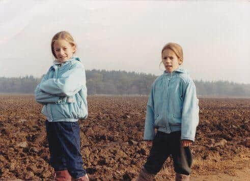 Caroline Flack (right) growing up with twin sister Jody.