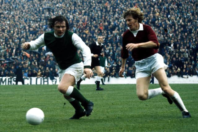 Joe Harper (left) in action for Hibs during the 1974/1975 campaign.
