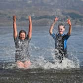 Swimmers enjoying the sunshine at Luss on Loch Lomond on Saturday. Picture: John Devlin