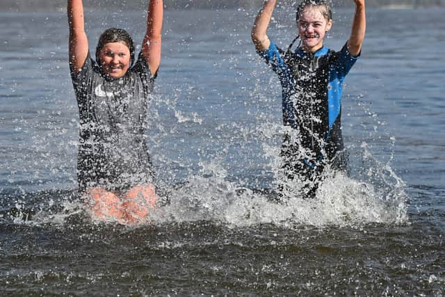 Swimmers enjoying the sunshine at Luss on Loch Lomond on Saturday. Picture: John Devlin