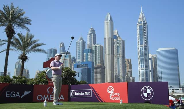 Bob MacIntyre hits his tee-shot on the first hole in the third round of the Omega Dubai Desert Classic at Emirates Golf Club. Picture: Andrew Redington/Getty Images.