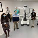 The surgical robot with NHS Tayside surgeons representing some of the cancer specialty areas