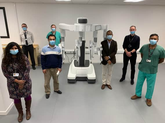 The surgical robot with NHS Tayside surgeons representing some of the cancer specialty areas