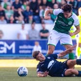 Joe Newell battles with Falkirk's Leon McCann during Hibs' 1-0 defeat on Tuesday. (Photo by Craig Foy / SNS Group)