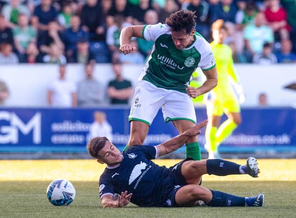 Joe Newell battles with Falkirk's Leon McCann during Hibs' 1-0 defeat on Tuesday. (Photo by Craig Foy / SNS Group)