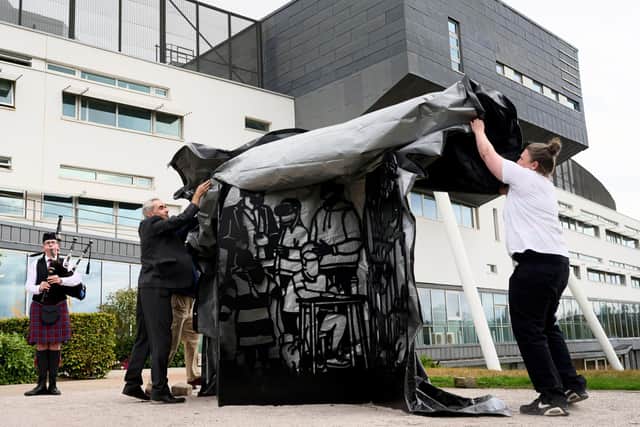 Martha Ellis and Professor Richard Butt unveiling the artwork on campus