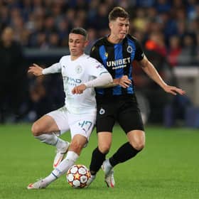 Club Brugge defender Jack Hendry battles Manchester City's Phil Foden for possession. Picture: Getty