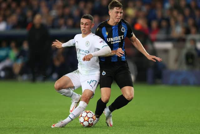 Club Brugge defender Jack Hendry battles Manchester City's Phil Foden for possession. Picture: Getty