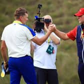 Ian Poulter congratulates US captain Steve Stricker on the home side's 19-9 win at Whistling Straits. Picture: Mike Ehrmann/Getty Images.