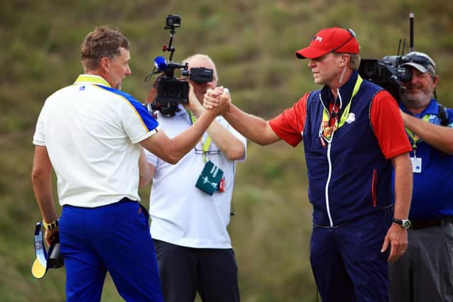 Ian Poulter congratulates US captain Steve Stricker on the home side's 19-9 win at Whistling Straits. Picture: Mike Ehrmann/Getty Images.