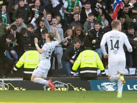 Elias Melkersen celebrates scoring to make it 2-0 to Hibs during a Scottish Cup match against  Motherwell at Fir Park.