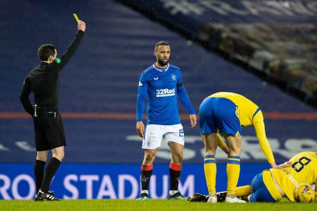 Rangers' Kemar Roofe (centre) is booked for a challenge on Murray Davidson during the Scottish Premiership match between Rangers and St Johnstone at Ibrox Stadium, on February 03, 2021, in Glasgow, Scotland. (Photo by Alan Harvey / SNS Group)