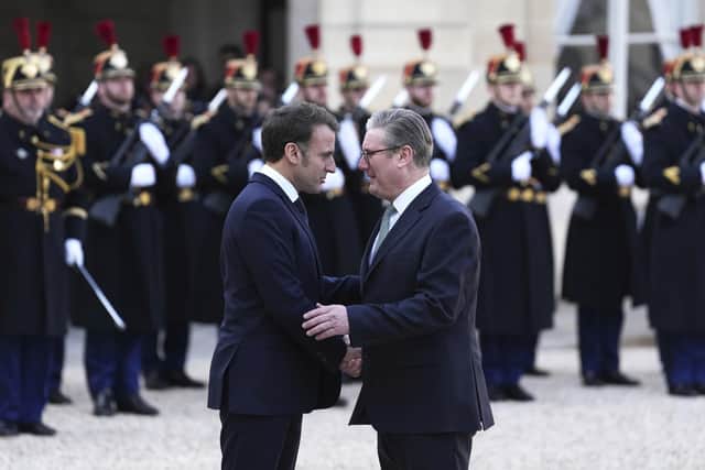 French President Emmanuel Macron, left, greets Britain's Prime Minister Keir Starmer as he arrives for an informal meeting of leaders. PIC: AP Photo/Aurelien Morissard