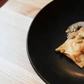 Starter of pumpkin and blue murder cheese ravioli with browned butter, crispy sage and toasted pumpkin seeds