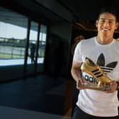 Footballer James Rodriguez received the adidas Golden Boot Trophy in recognition of scoring the most goals during the 2014 FIFA World Cup.