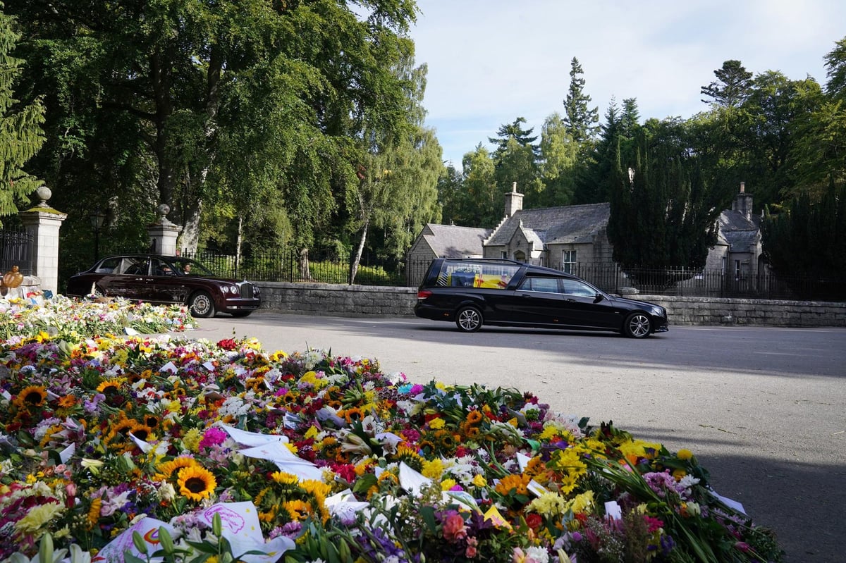 Pipes and flowers from Balmoral as Elizabeth II leaves beloved castle for the last time