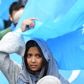 A woman takes part in a protest march in Brussels over the 're-education' camps for ethnic Uyghurs in China (Picture: Emmanuel Dunand/AFP via Getty Images)