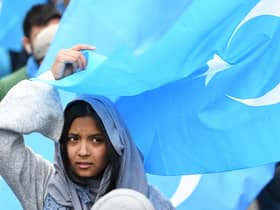 A woman takes part in a protest march in Brussels over the 're-education' camps for ethnic Uyghurs in China (Picture: Emmanuel Dunand/AFP via Getty Images)