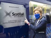 Nicola Sturgeon unveiled a specially branded train at Glasgow Queen Street Station to mark ScotRail becoming publicly owned (Picture: Robert Perry/PA)