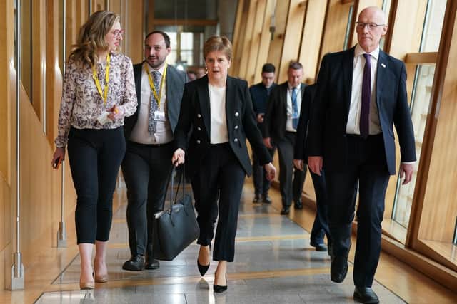 Former first minister Nicola Sturgeon (centre) alongside her former deputy John Swinney. Picture: Andrew Milligan/PA Wire
