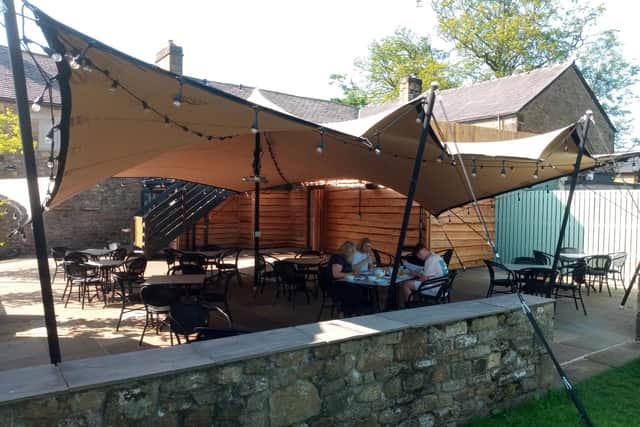 The Derby Arms' outside canopy and dining area