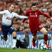 Former Tottenham midfielder Christian Eriksen and Liverpool's Andrew Robertson in action during a Premier League match in 2019. (Photo by Clive Brunskill/Getty Images)