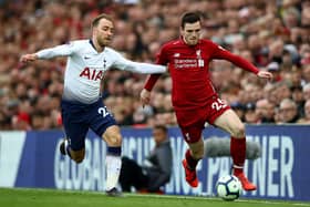 Former Tottenham midfielder Christian Eriksen and Liverpool's Andrew Robertson in action during a Premier League match in 2019. (Photo by Clive Brunskill/Getty Images)