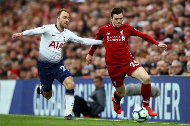Former Tottenham midfielder Christian Eriksen and Liverpool's Andrew Robertson in action during a Premier League match in 2019. (Photo by Clive Brunskill/Getty Images)