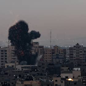 Smoke rises above buildings in Gaza City after Israel launched air strikes on the Palestinian enclave on February 23 (Picture: Mohammed Abed/AFP via Getty Images)