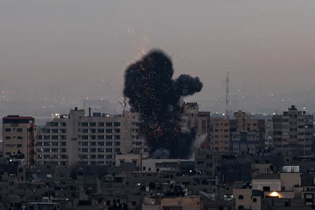 Smoke rises above buildings in Gaza City after Israel launched air strikes on the Palestinian enclave on February 23 (Picture: Mohammed Abed/AFP via Getty Images)