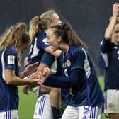Scotland's Lisa Evans (L) and Caroline Weir celebrate at full time after the 1-0 win over Austria. (Photo by Alan Harvey / SNS Group)