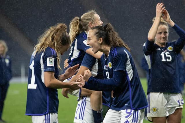 Scotland's Lisa Evans (L) and Caroline Weir celebrate at full time after the 1-0 win over Austria. (Photo by Alan Harvey / SNS Group)