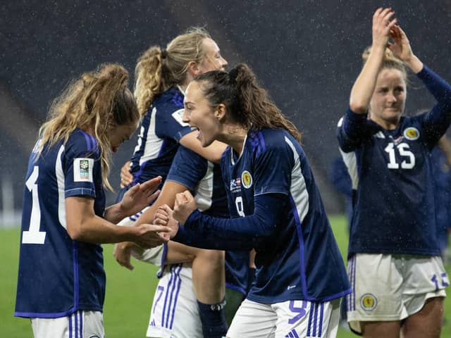 Scotland's Lisa Evans (L) and Caroline Weir celebrate at full time after the 1-0 win over Austria. (Photo by Alan Harvey / SNS Group)
