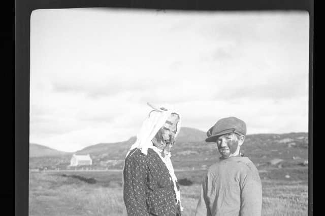 The guisers, or gìsears, would carry lit peats to guide them from house to house, where they gave a song or told a fealla-dha (joke) in return for a treat, usually a scone or a bannock. PIC: South Uist Guisers 1932 from Margaret Faw Shaw Photographic Archive, NTS Canna House.