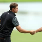 Ludvig Aberg shakes hands with Edoardo Molinari, one of Luke Donald's Ryder Cup vice captains, after they played tohether in the opening two rounds of the Hero Dubai Desert Classic at Emirates Golf Club in January. Picture: Luke Walker/Getty Images.