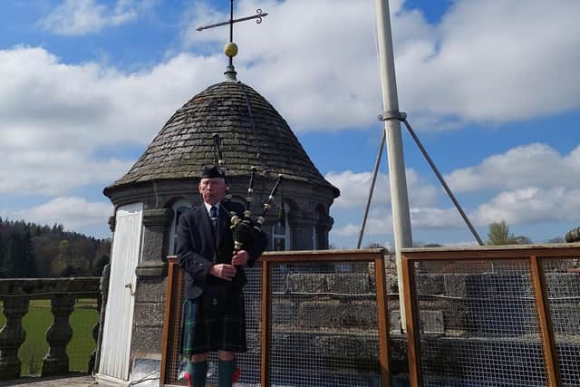 Mr David Fraser (Gordon Highlanders Association Pipe Band) pipes new Aberdeenshire flag at Castle Fraser (NTS)