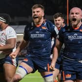 Edinburgh's Luke Crosbie and Dave Cherry celebrate after Pierre Schoeman scores a second-half try against Saracens.