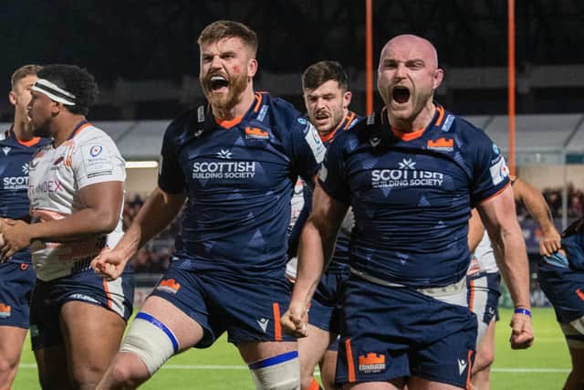 Edinburgh's Luke Crosbie and Dave Cherry celebrate after Pierre Schoeman scores a second-half try against Saracens.