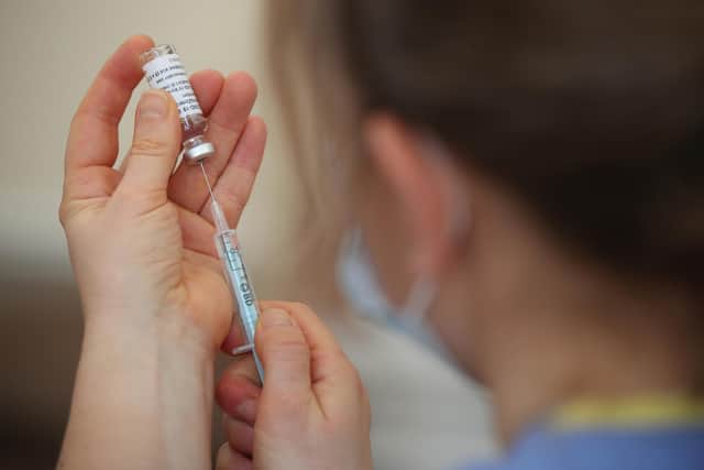 A nurse prepares a dose of Covid-19 vaccine (Picture: Nick Potts/PA)